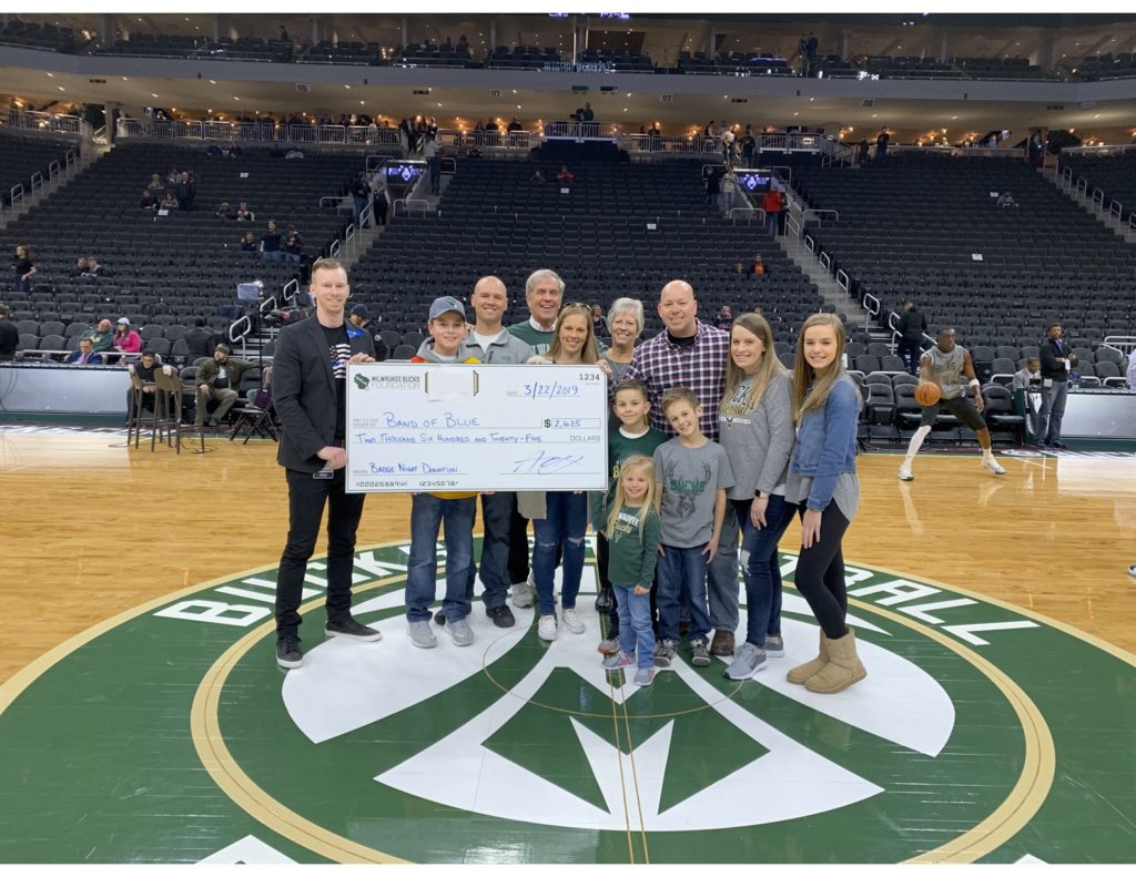 Band of blue getting a check at the Bucks game.